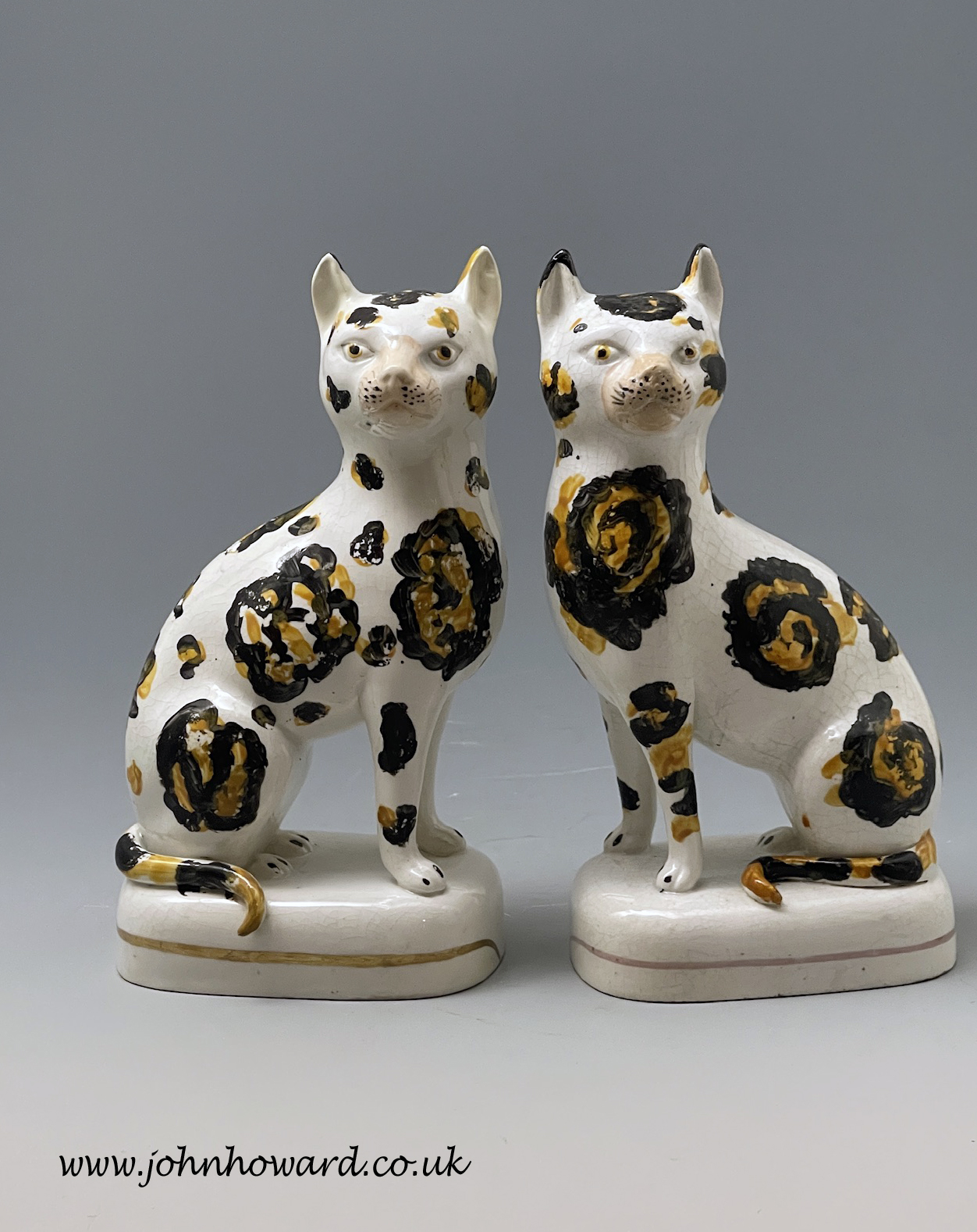 Rare pair of Staffordshire pottery figures of seated cats mid 19th
