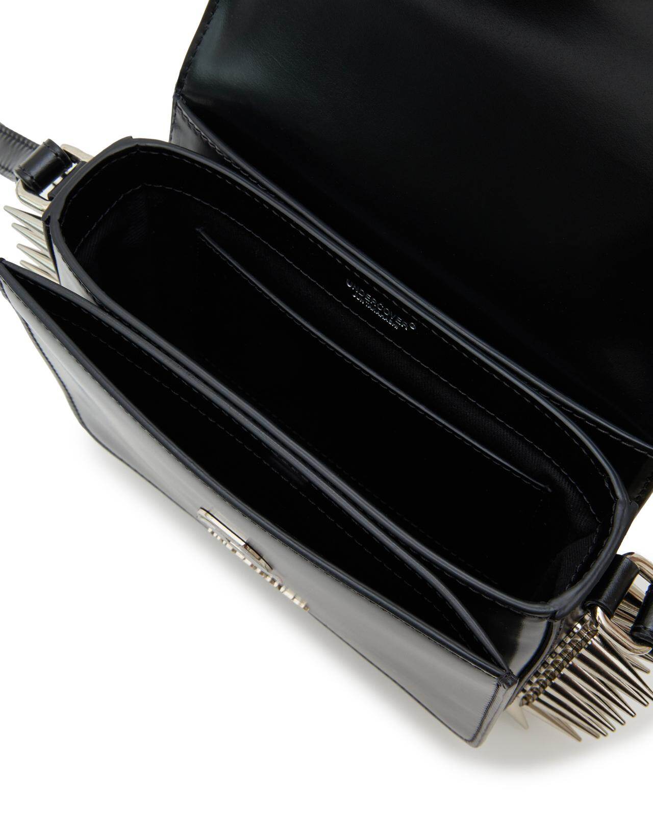 アンダーカバー“目玉”クラスプのレザーショルダーバッグ、大胆なメタル