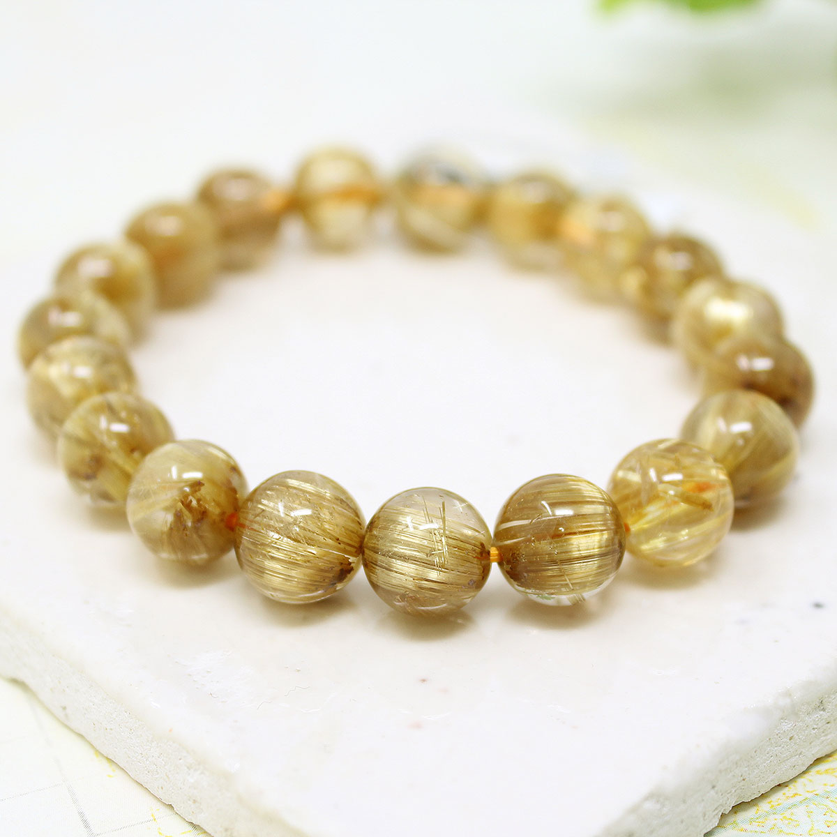 極上 10-10.5ミリ タイタン ルチルクォーツ （金線入水晶