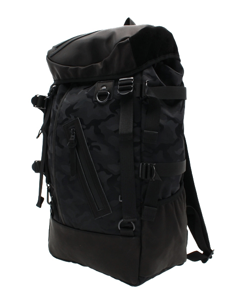 DECADE（ディケイド）の「迷彩ナイロンxレザー・バックパック DECADE