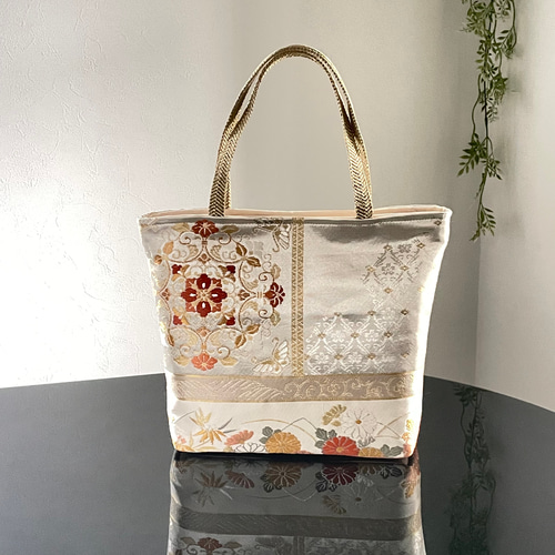 帯リメイクバッグ オレンジとゴールドの華文様 Mサイズ 和装バッグ 帯