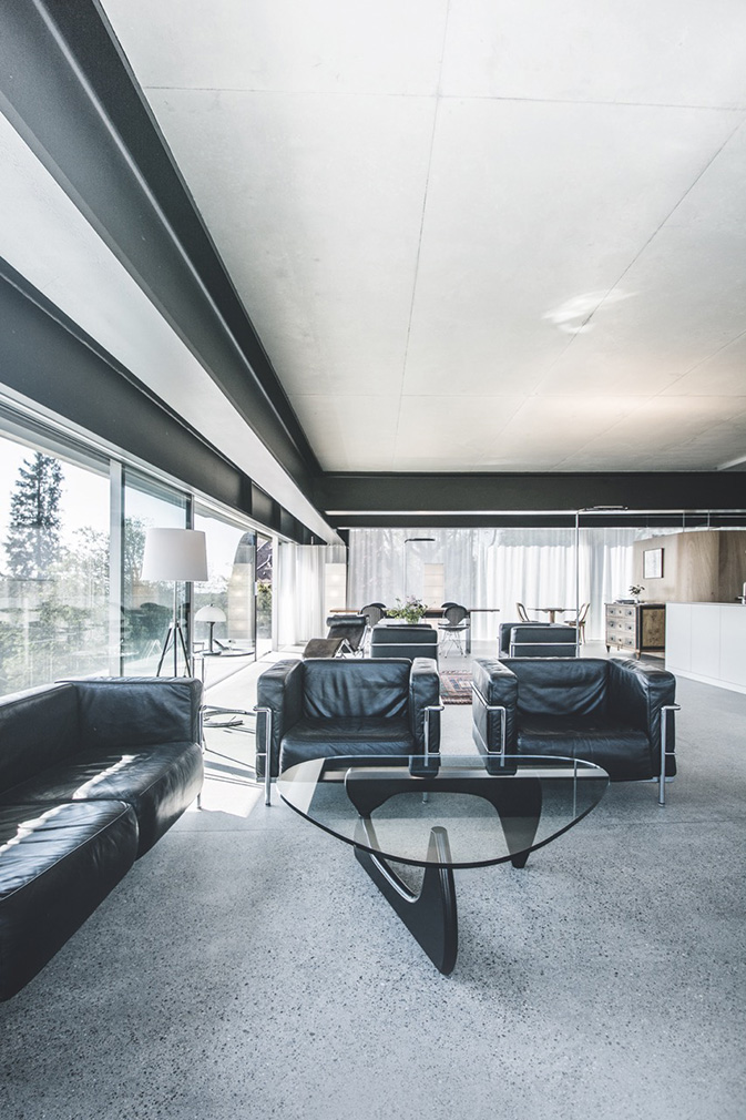 A radical hillside house suspends living space above residential