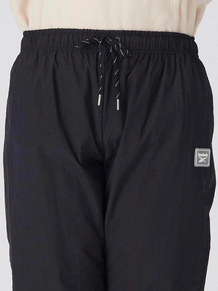 ブラック 【Reebok(リーボック)】ナイロンワッシャーメッシュパンツ