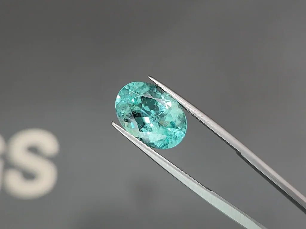 Neon greenish blue Paraiba tourmaline in oval cut 5.51 carats