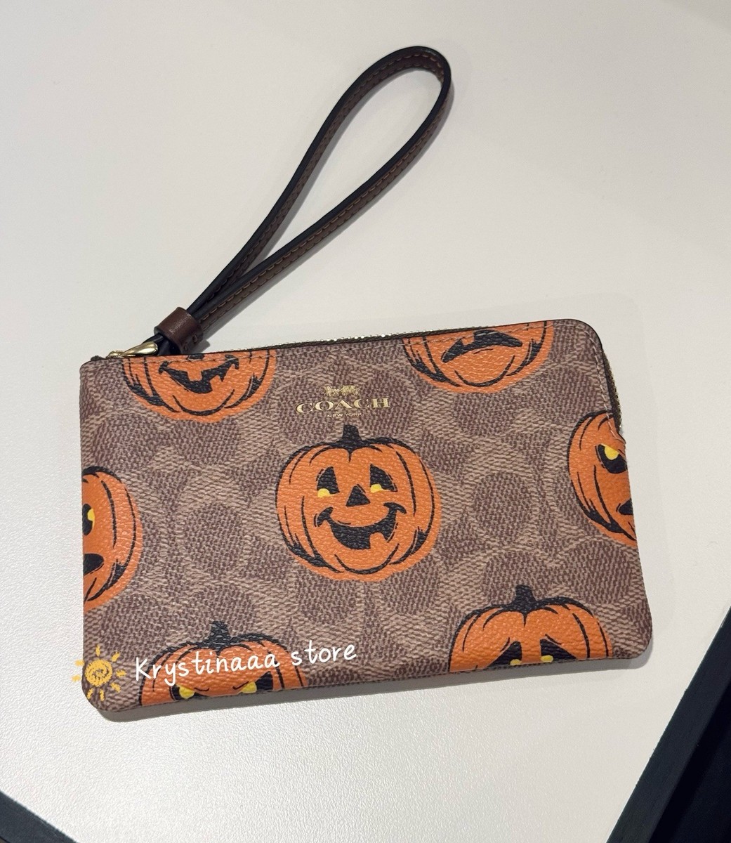 Coach Corner Zip Wristlet in Signature Canvas With Pumpkin Print