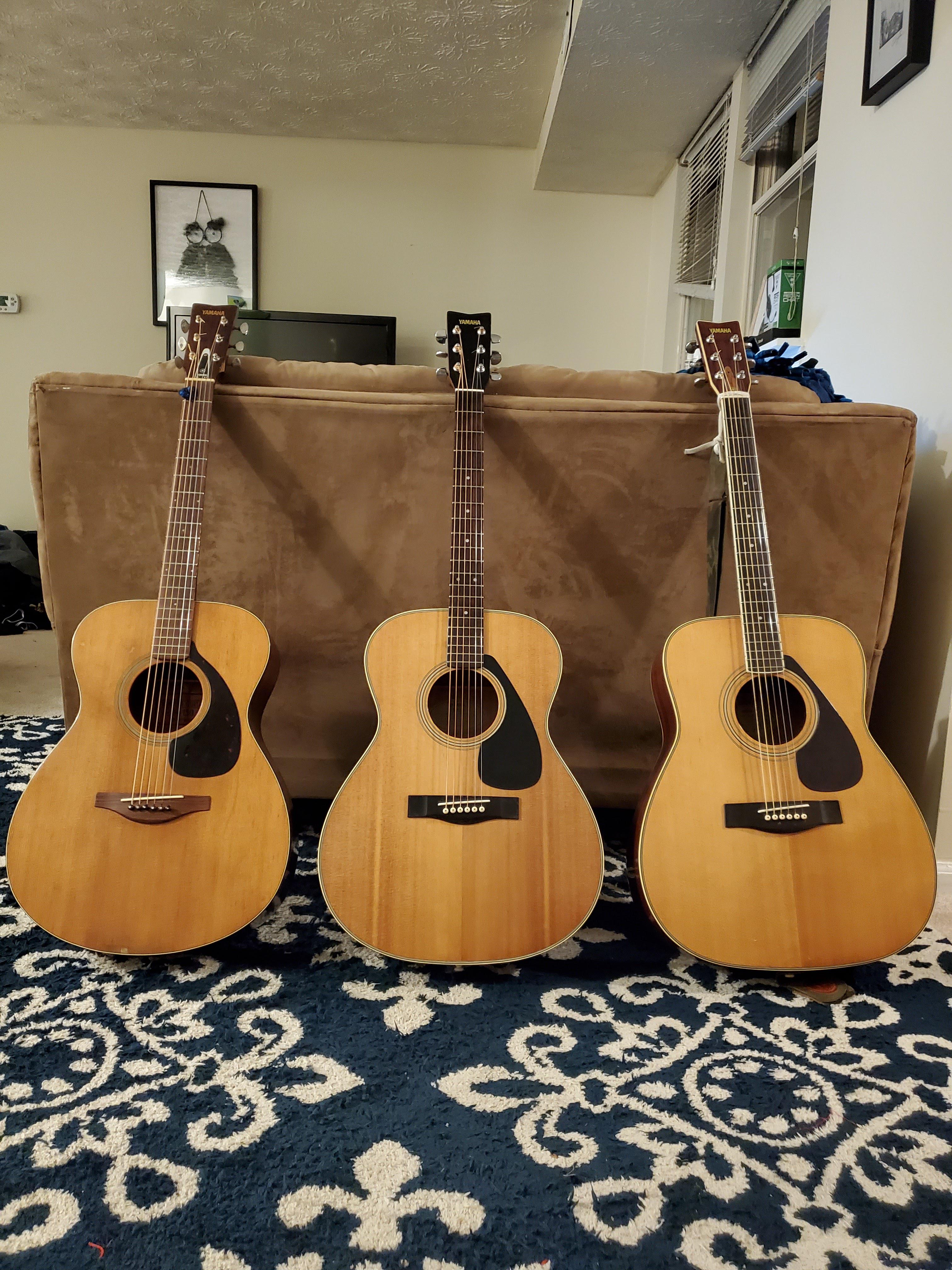 My three Yamaha beauties. Left to right: early 70s FG-150 red
