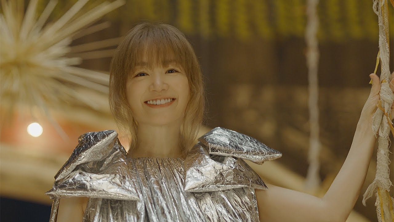 YUKI appears on stage riding on a star, representing 50-year-old