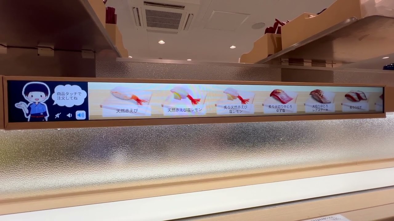 寿司が流れる回転寿司サイネージのセレンディピティなメディア特性