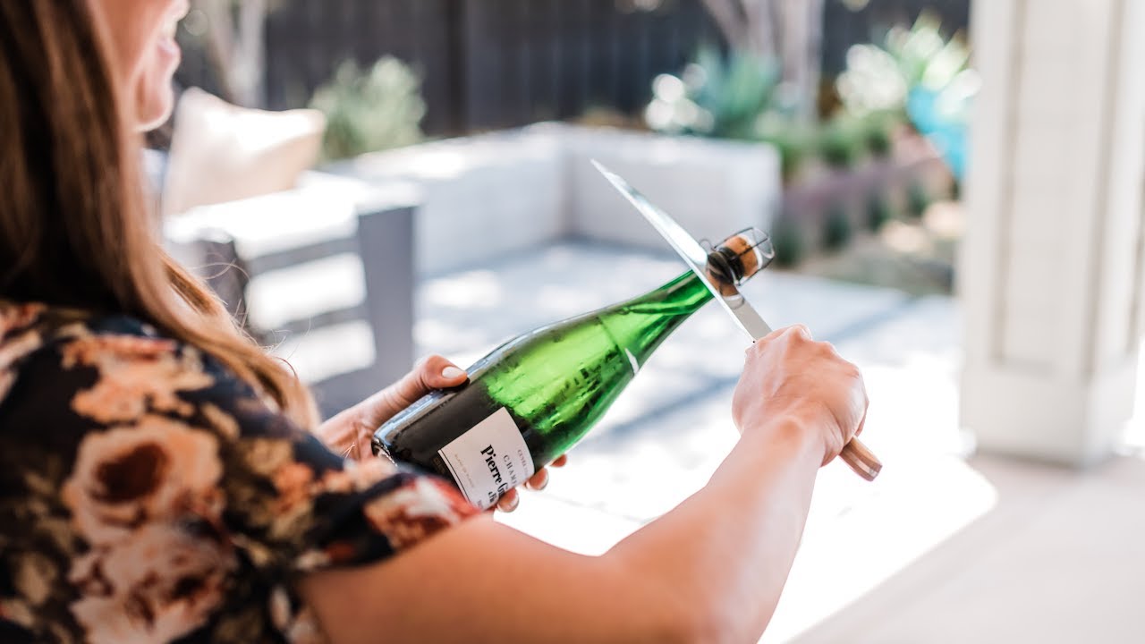 How to Saber a Bottle of Champagne | We Drink Bubbles