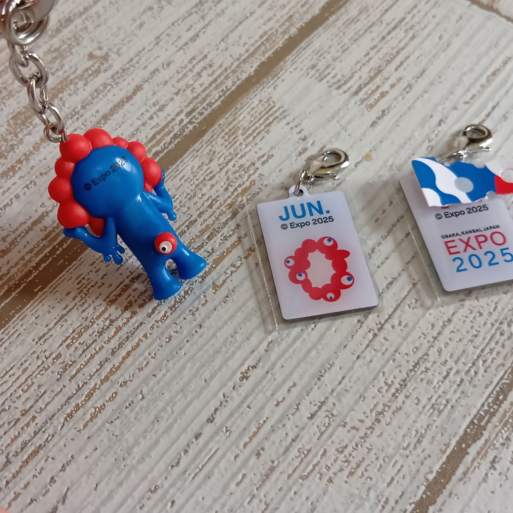 株式会社モノコム 万博公式グッズ：2025アニバーサリーキーホルダーの