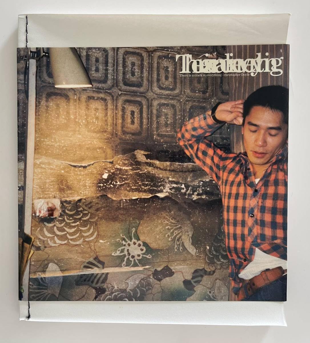 Amazon.co.jp: クリストファードイル写真集There is a crack in