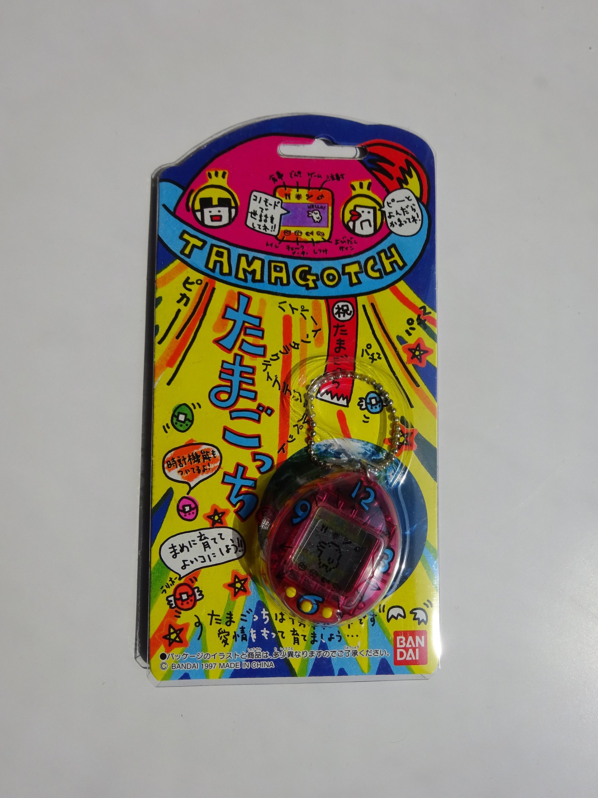 Amazon.co.jp: バンダイ 初代 たまごっち スケルトンピンク色（時計柄