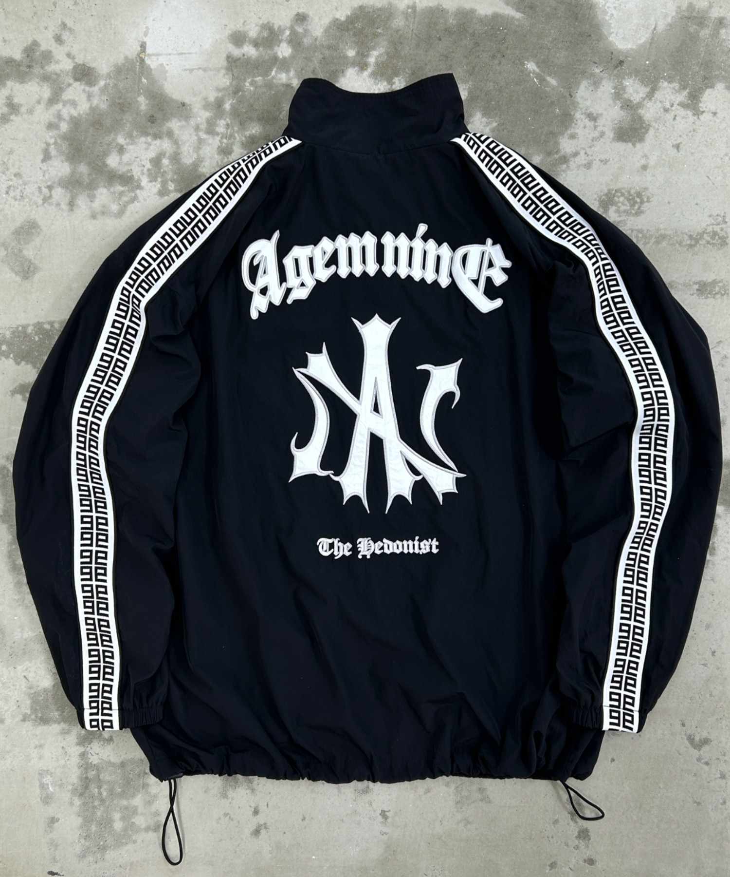 A'GEM/9 × .kom 『A'GEM/9/エージェムナイン』 ジャガードロゴナイロン