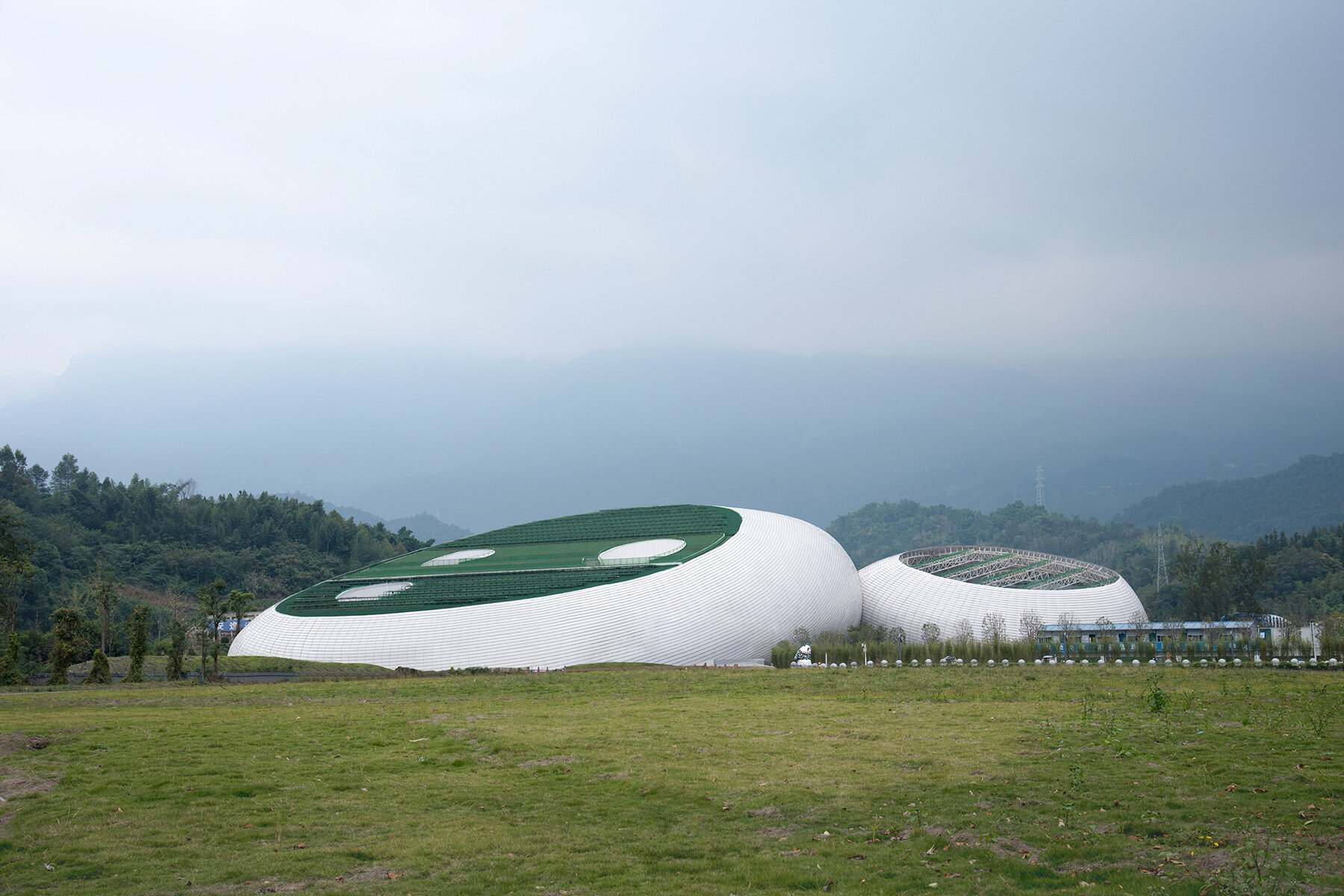 panda-shaped cradle defines biodiverse performance hub by ZXD