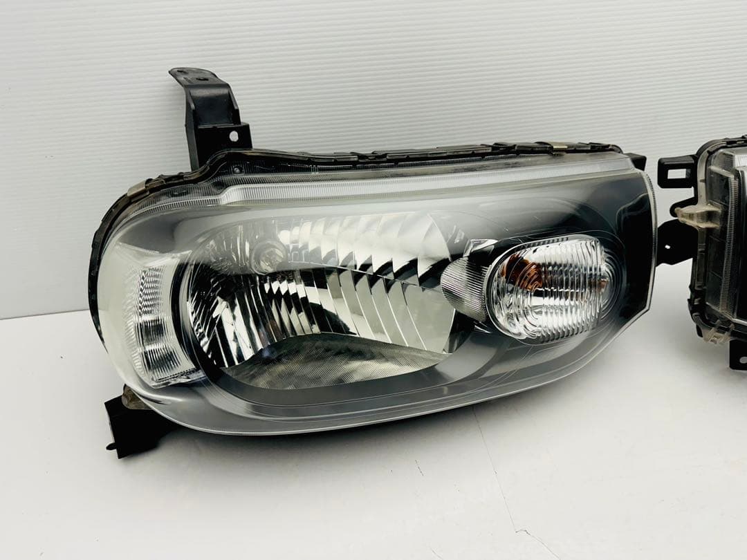 日産 キューブ ヘッドライト ヘッドランプ ハロゲン STANLEY P8190