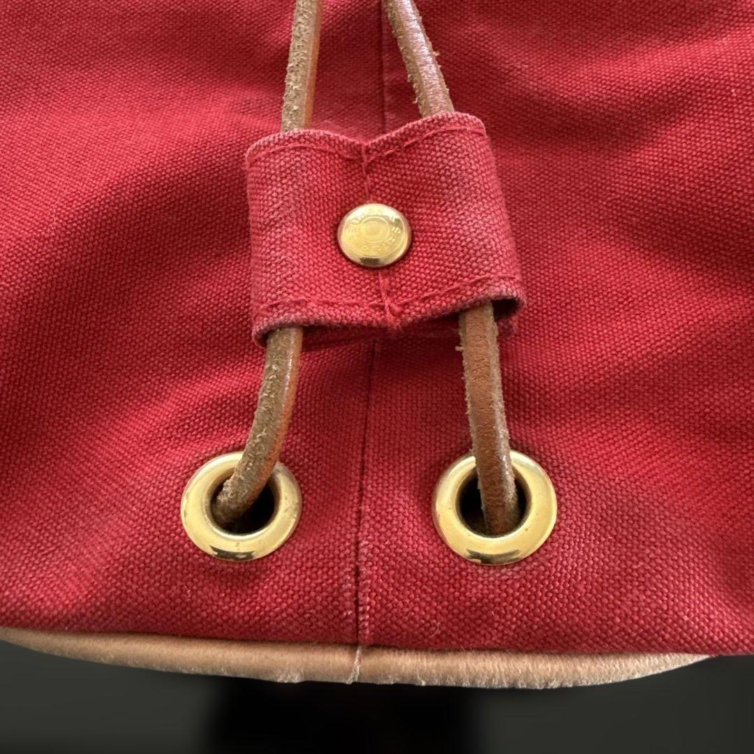 エルメス赤いキャンバスドローストリングショルダーバック