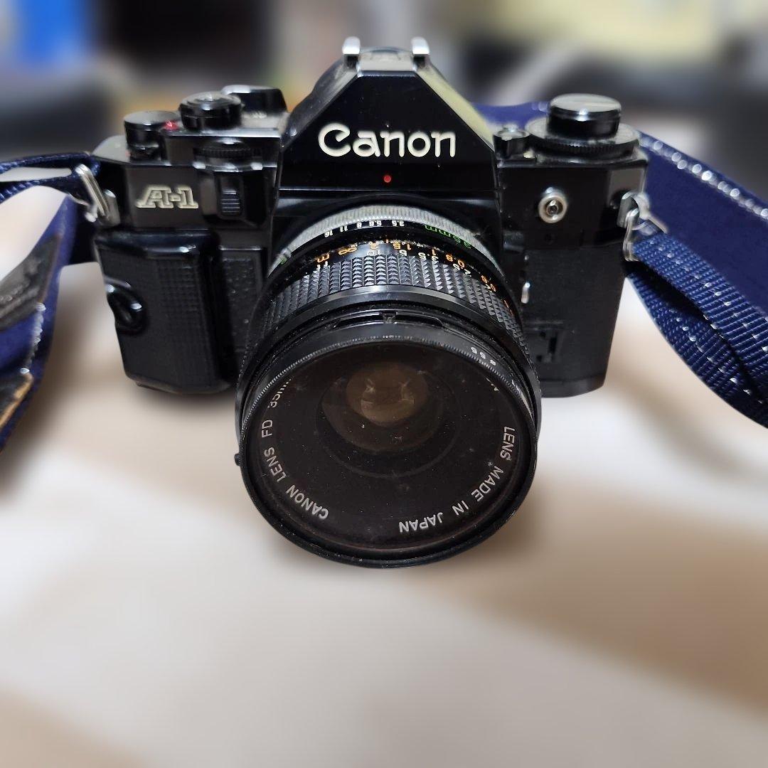 Canon A-1 フィルムカメラ 35mmレンズ付き - メルカリ