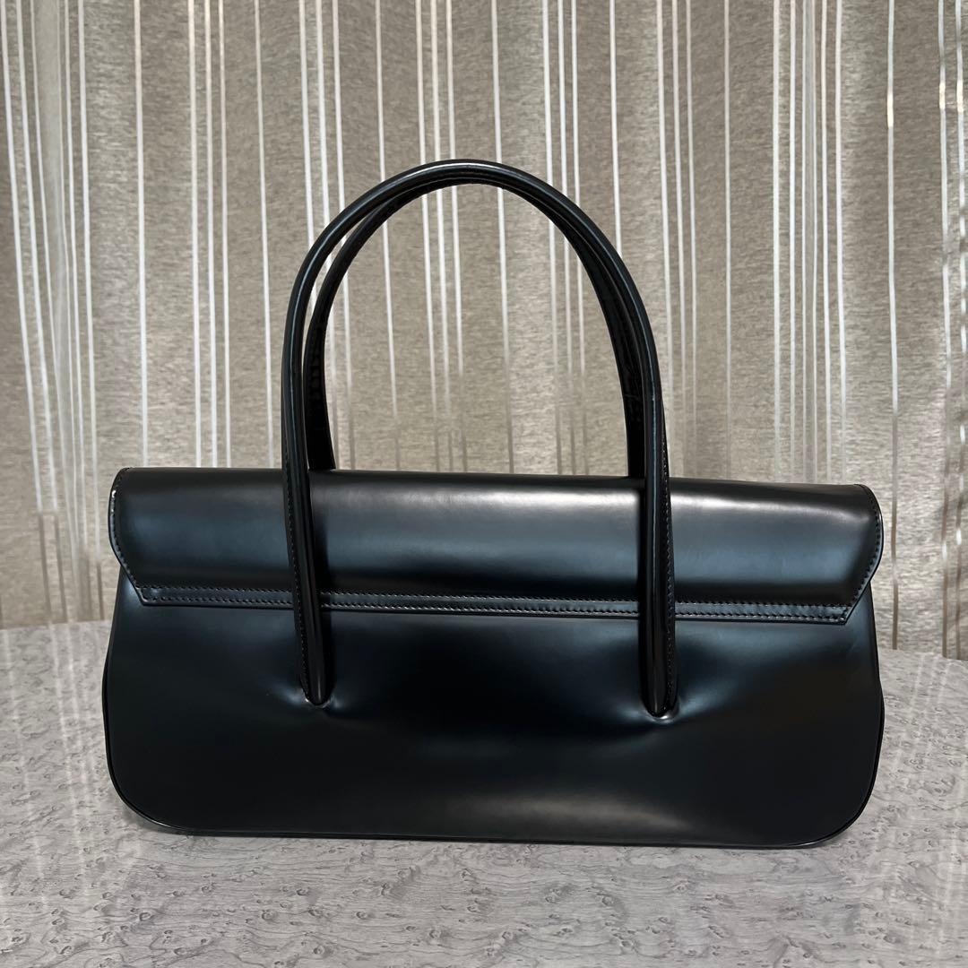 コムデギャルソン 青山オリジナルステアバック 横長 黒 - メルカリ