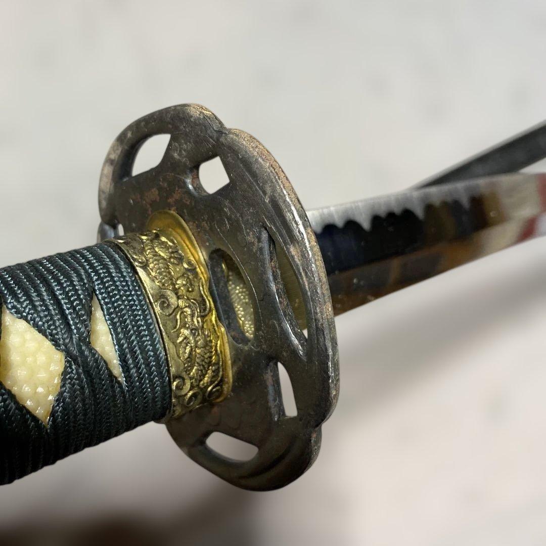 格安模造刀大刀 濃緑柄 波絵透し丸鍔 黒梨地鞘 - メルカリ