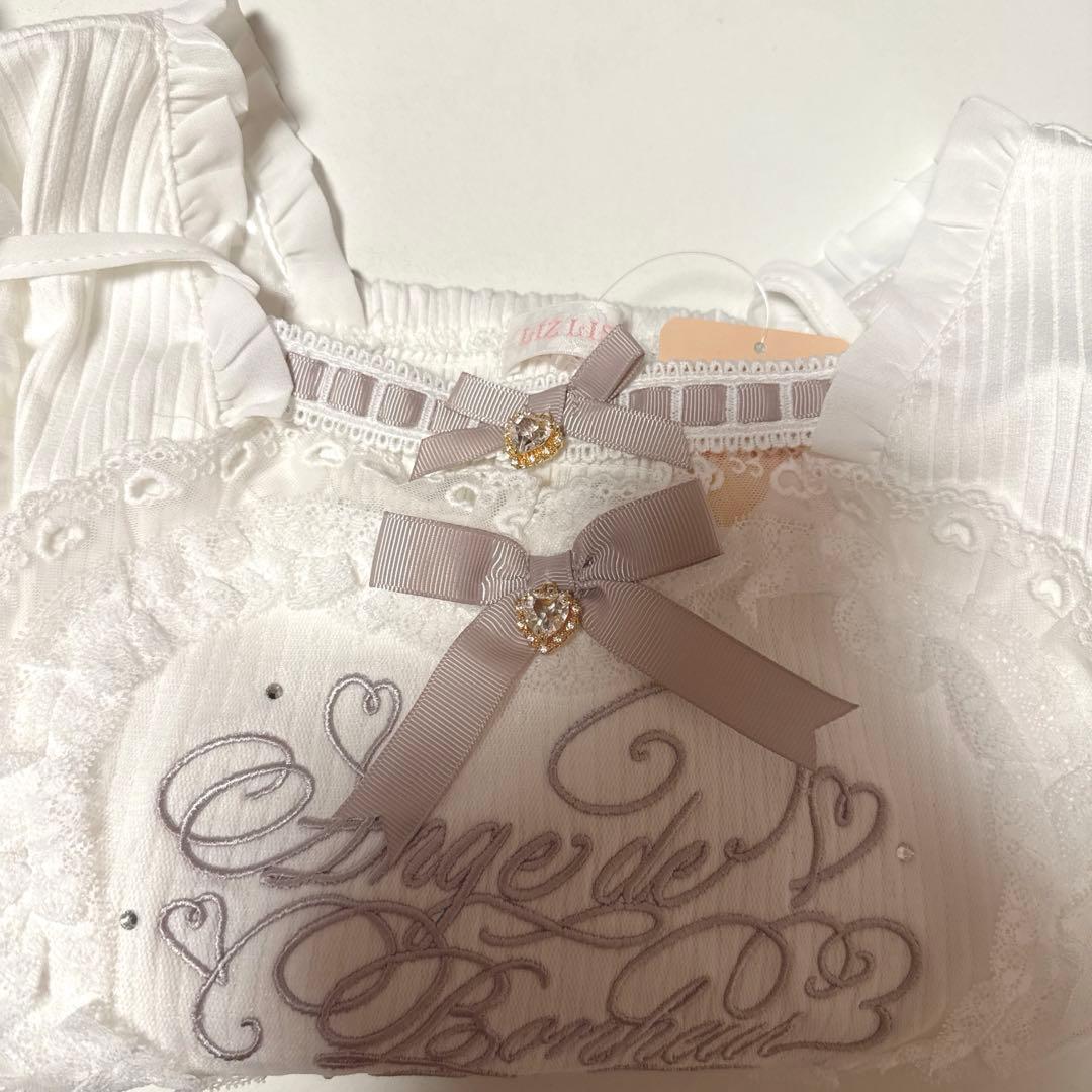 フリルハートリボンスリーブトップス ピンク - メルカリ