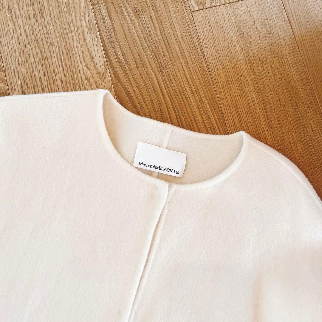 mid. エムプルミエ ブラック ノーカラーフレアケープコート アイボリー