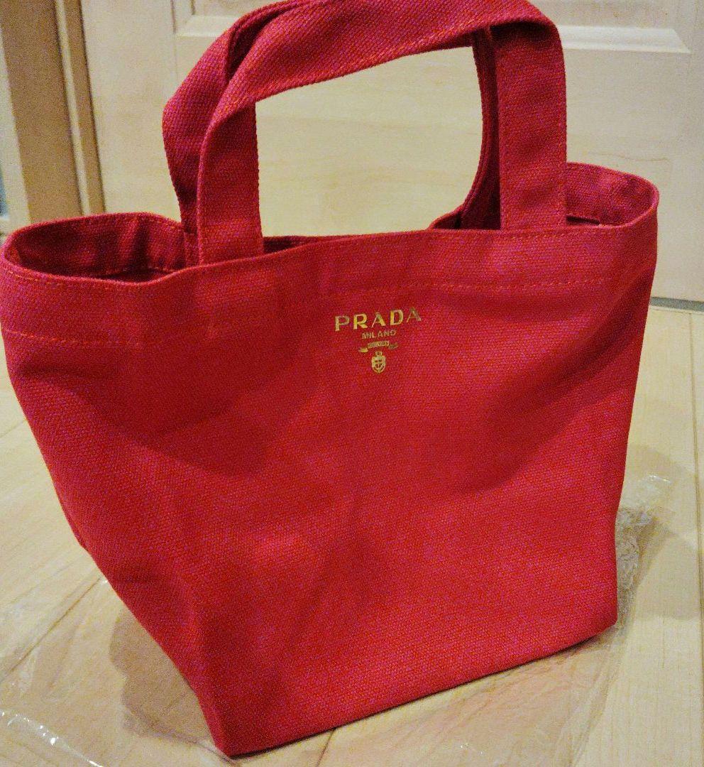 PRADA ノベルティキャンバストートバッグ レッド - メルカリ