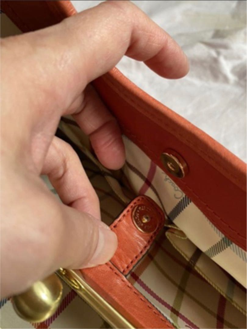 コーチ オレンジ エルゴレザープリーテッドフレームドサッチェルの通販