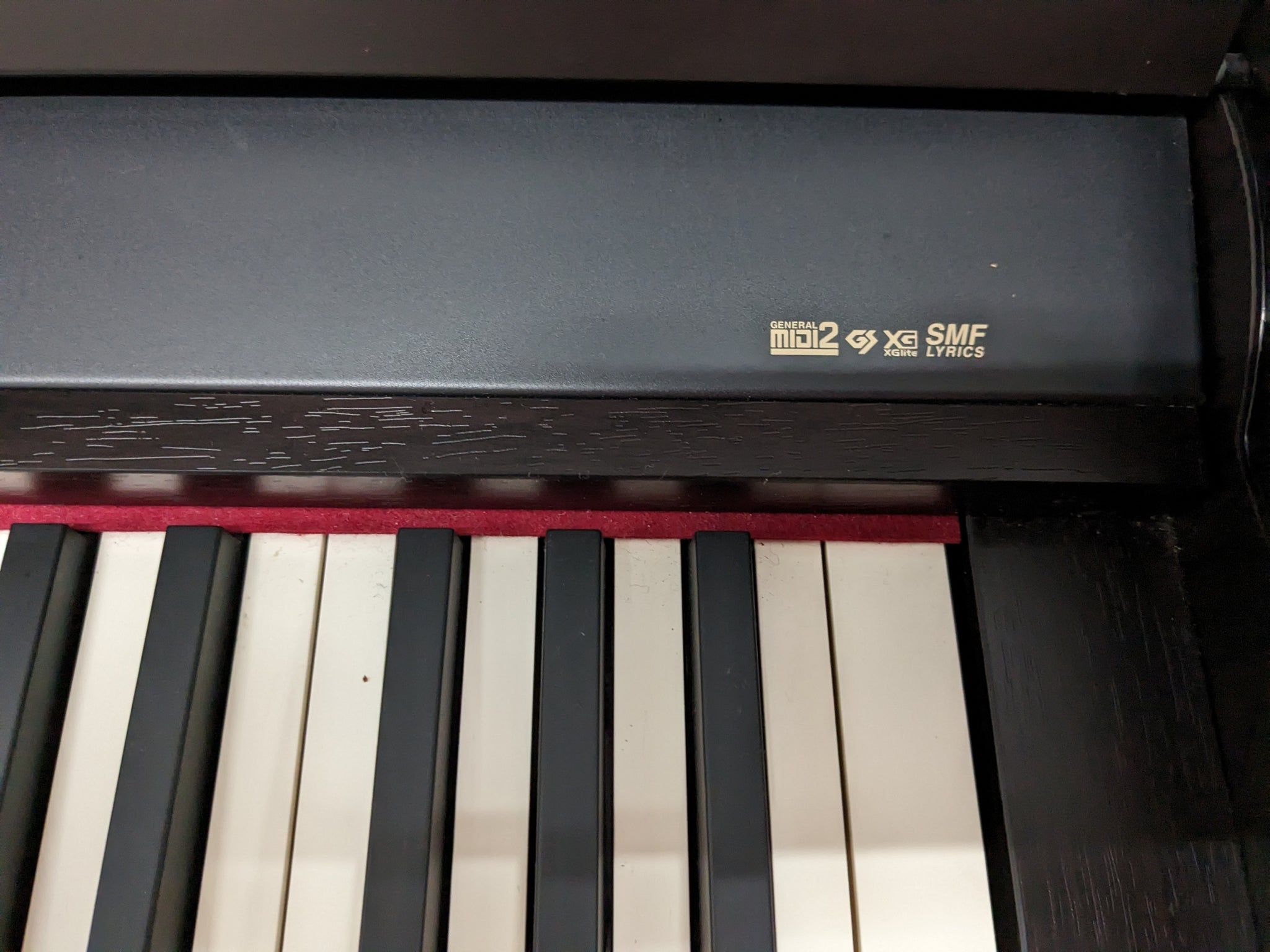 Roland HP-307 Digital Piano in dark rosewood wooden action keys